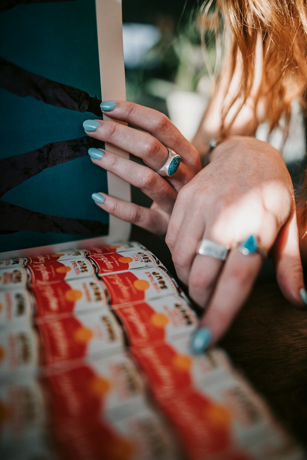 a close up of a person with a ring on their finger