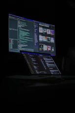 a laptop computer sitting on top of a desk