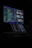A sleek, dark-themed workspace with a programmer coding on a laptop under ambient lighting and tech posters.