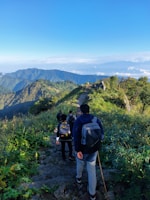 A group of happy travelers enjoying a scenic hike together.
