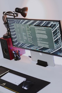 a computer monitor sitting on top of a desk