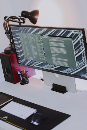 a computer monitor sitting on top of a desk