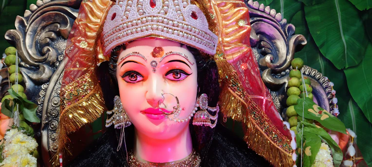 Portrait of Iyalorixa Rita de Cássia Fonseca in traditional Candomblé attire, surrounded by sacred elements.