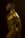 A side profile of a person with a muscular build covered in gold body paint. The image features dramatic lighting that highlights the contours of the body against a dark background, creating a striking visual contrast.