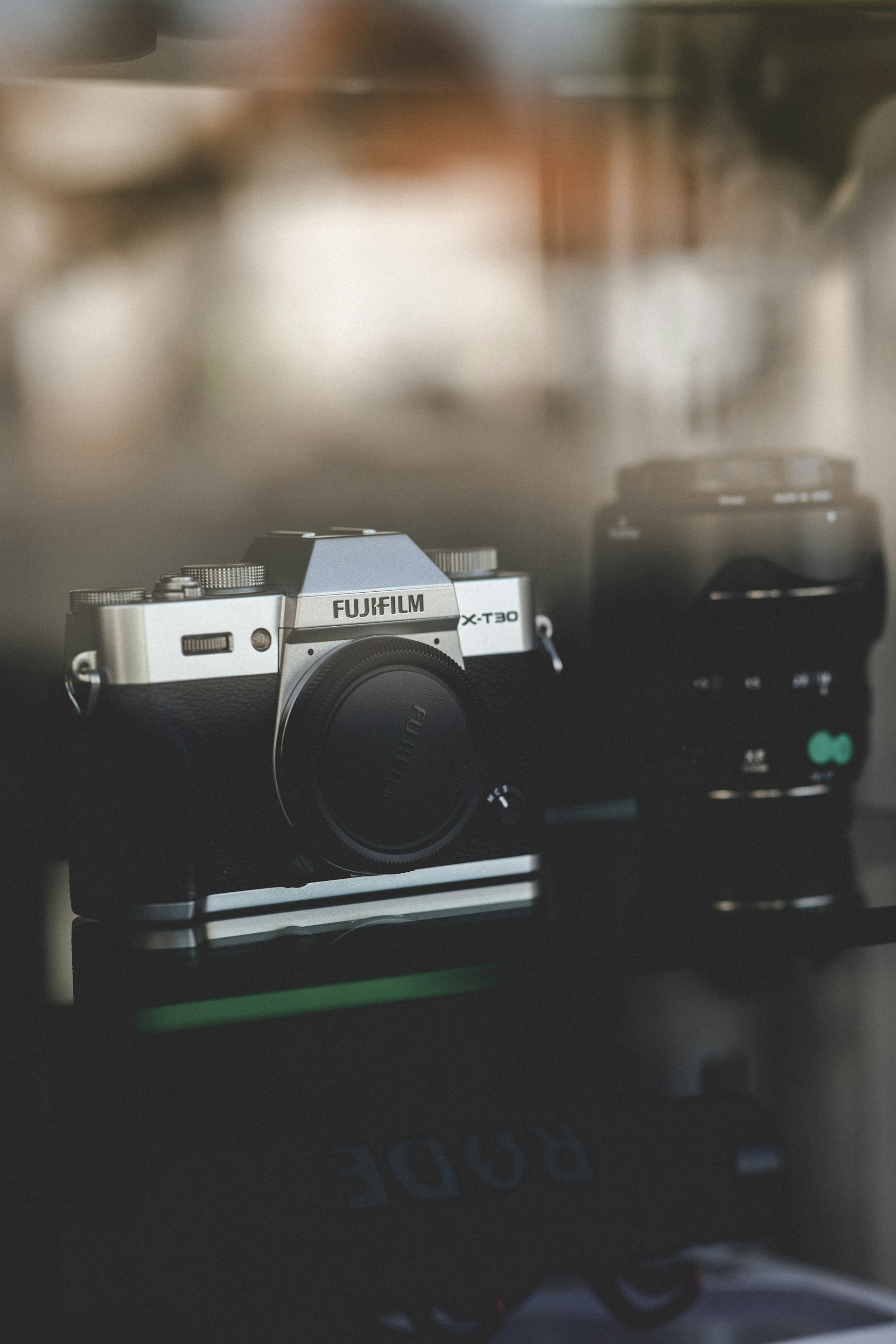a camera sitting on top of a table next to a window