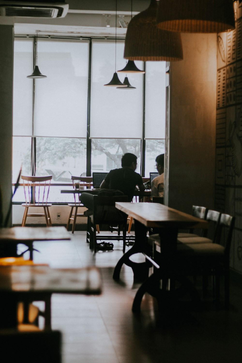 a man sitting at a table in a restaurant