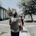 a group of people walking down a sidewalk