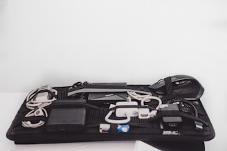 Various computer accessories like headphones, mouse, and cables