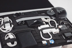 a black case filled with electronics and cords