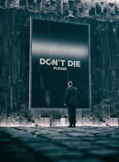 a person standing in front of a brick building