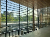 A bright veranda with spotless glass panels letting in natural light.