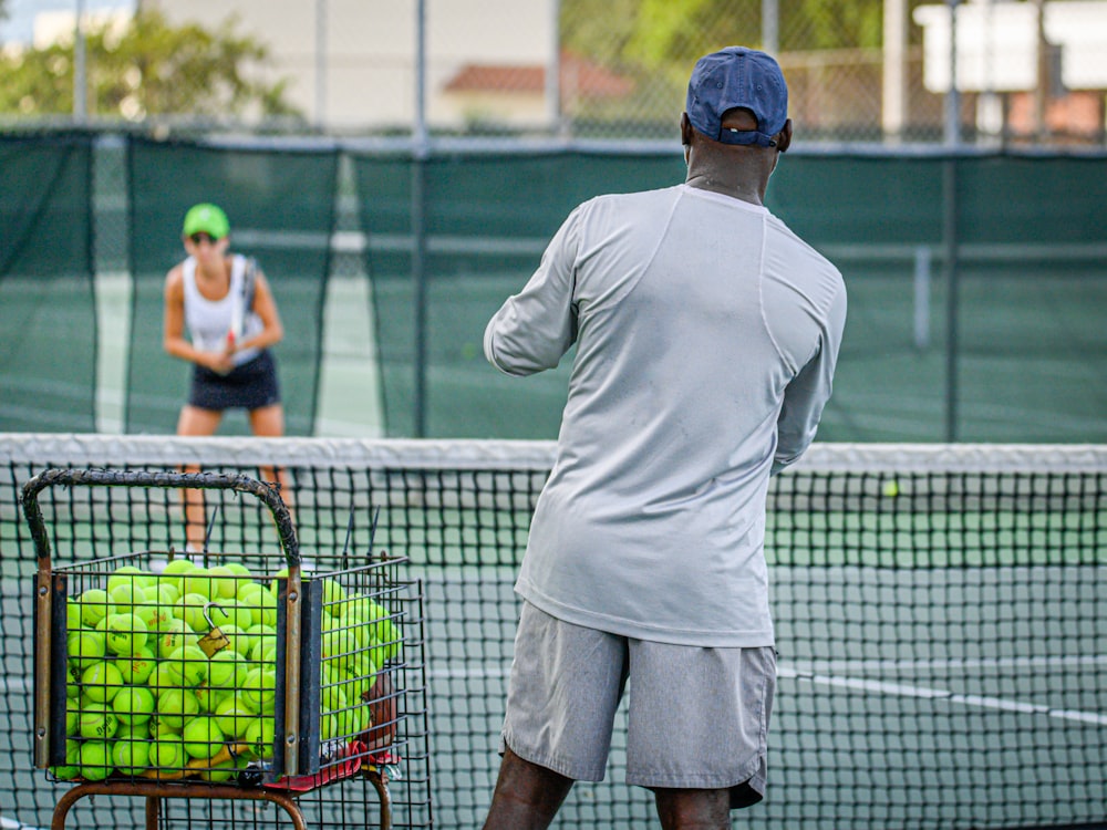 a man and a woman playing tennis on a tennis court