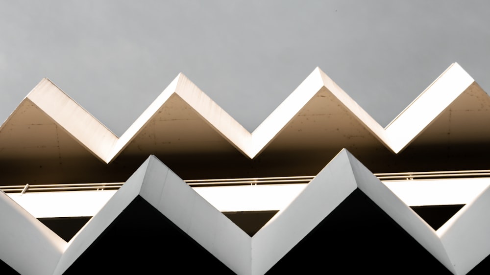 a close up of a building with a sky in the background