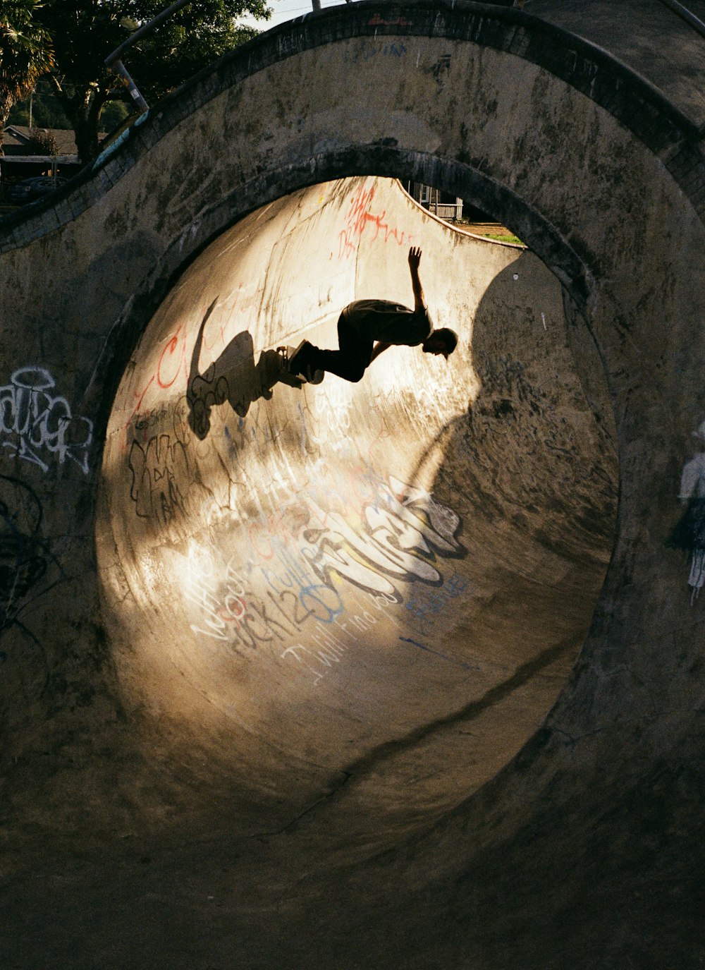 a man riding a skateboard up the side of a ramp