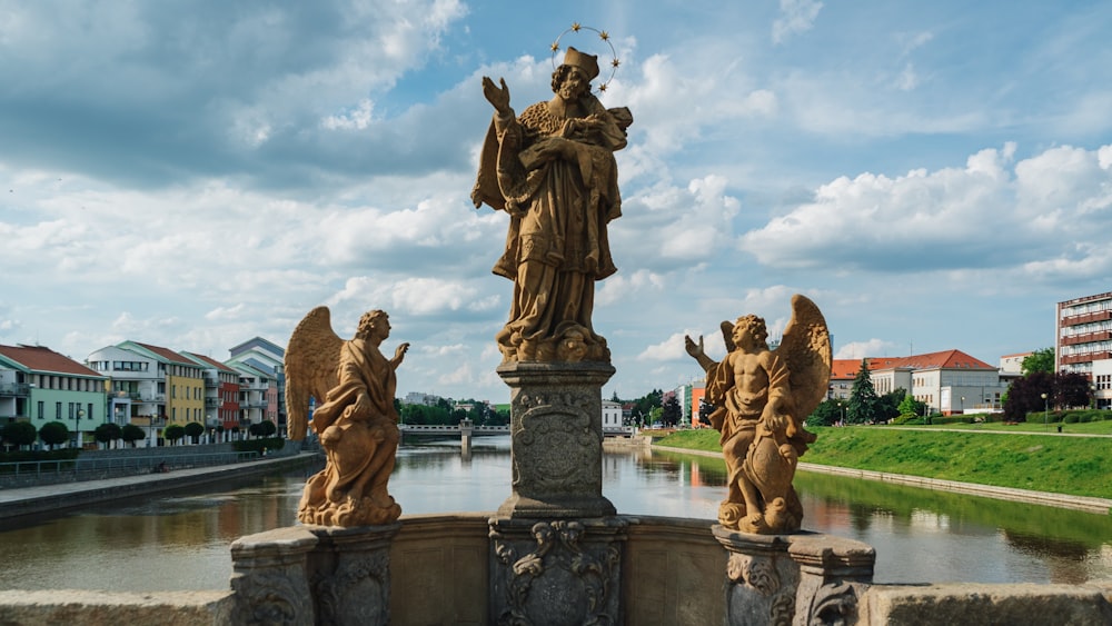 statues of angels on a bridge over a river