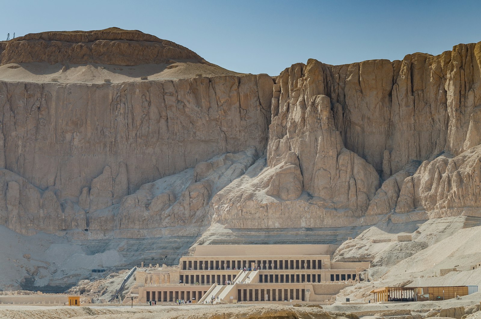 The terraced Temple of Hatshepsut beneath towering limestone cliffs on Luxor's West Bank