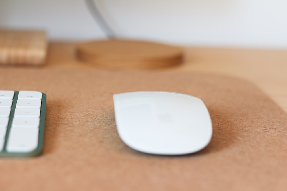 a computer mouse and keyboard on a desk