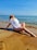 A happy customer enjoying a vacation at the beach.