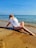 A happy customer enjoying a vacation at the beach.