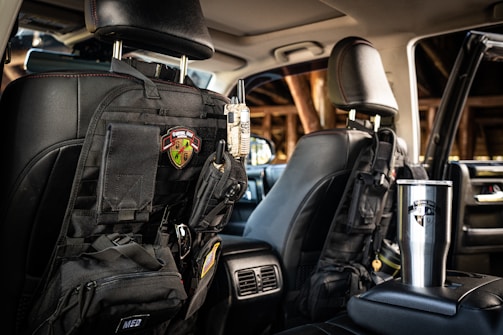 a back seat of a car with a backpack on it