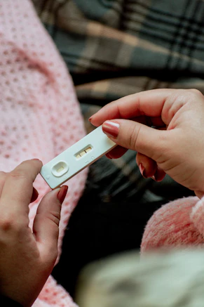 a person holding a cell phone in their hands