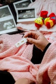 a person holding a baby's name tag in their hand