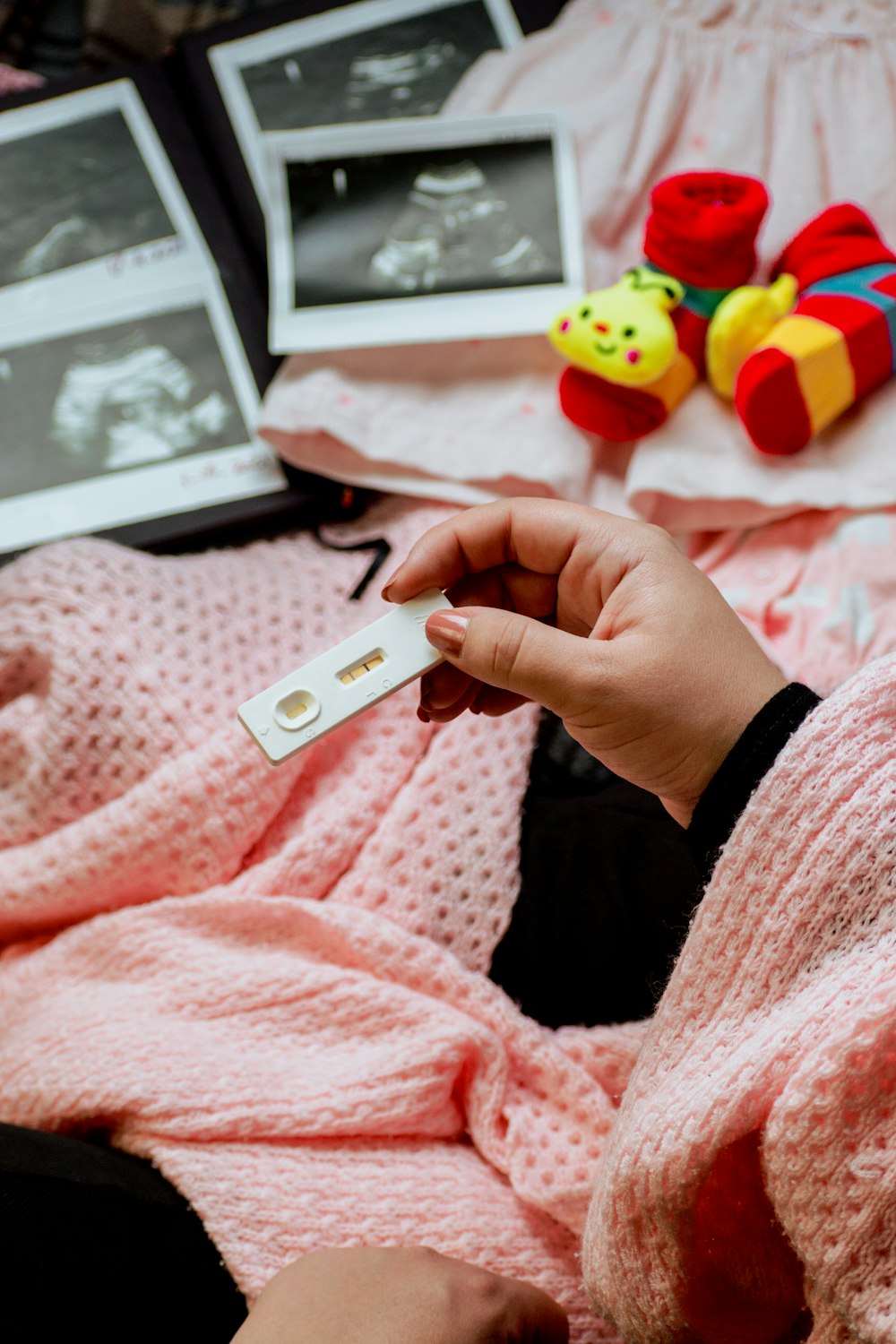 a person holding a baby's name tag in their hand