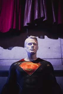 a statue of a man in a superman suit