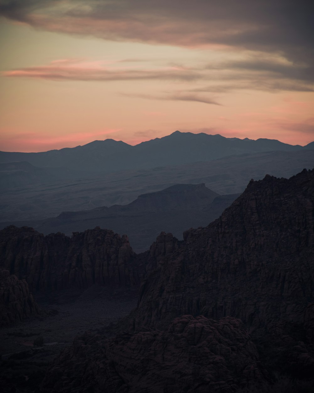 a view of a mountain range at sunset