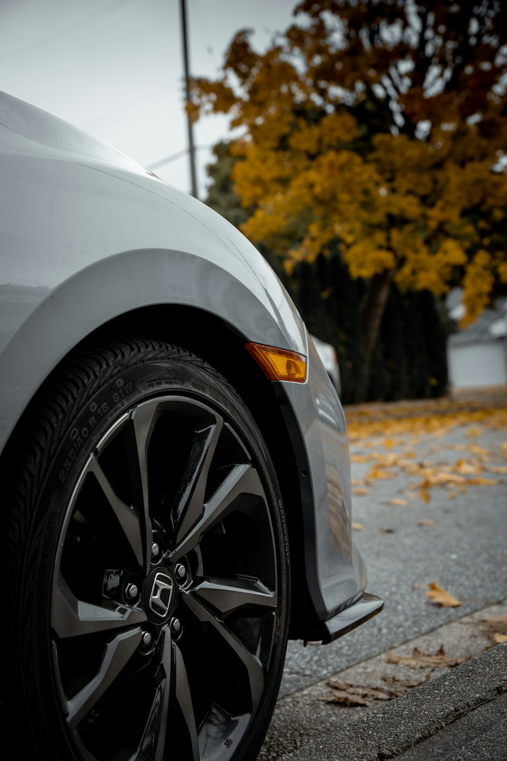 a white car parked on the side of the road