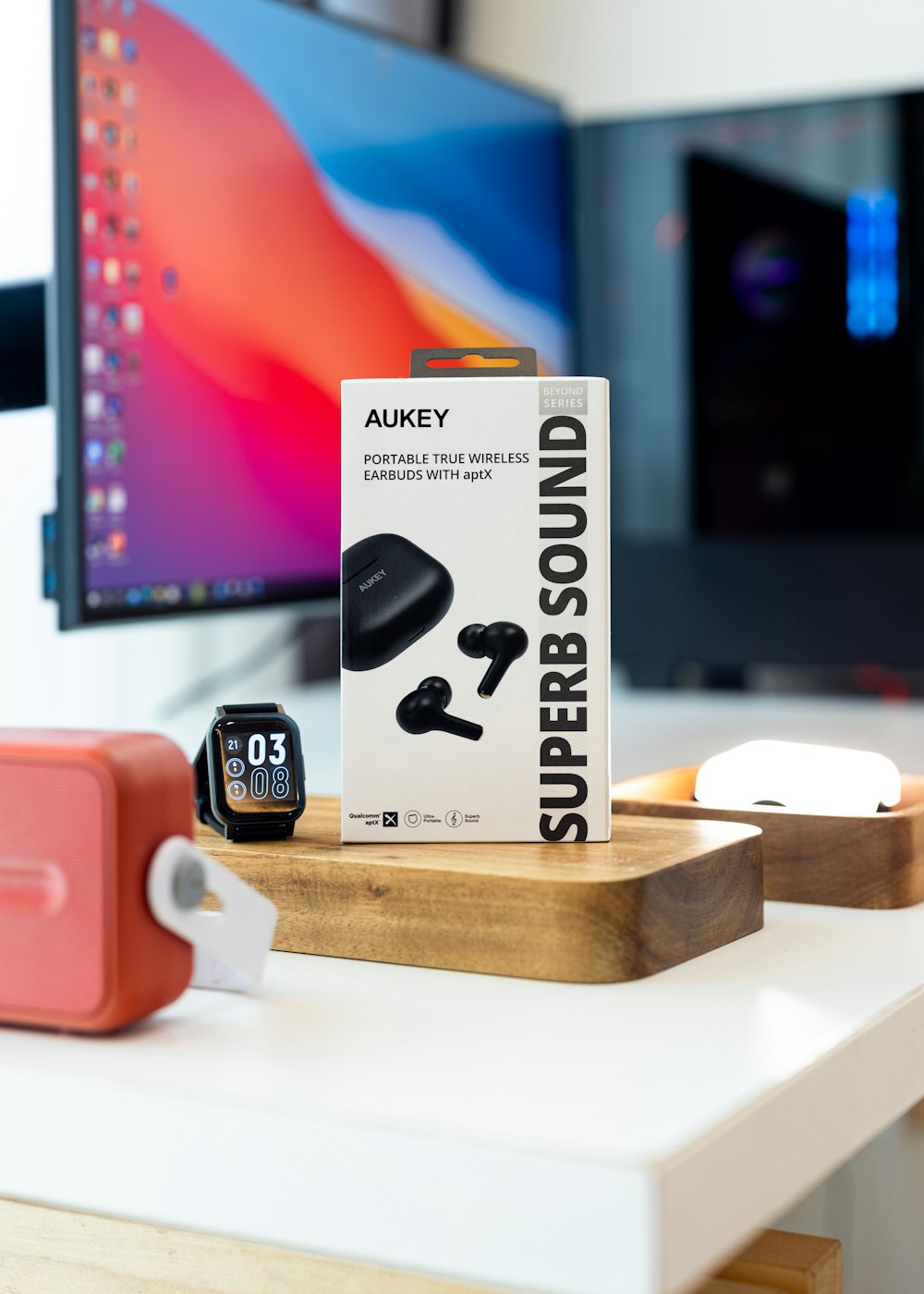 a box of ear buds sitting on top of a desk