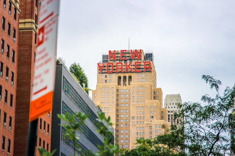 a sign that reads new yorker on top of a building