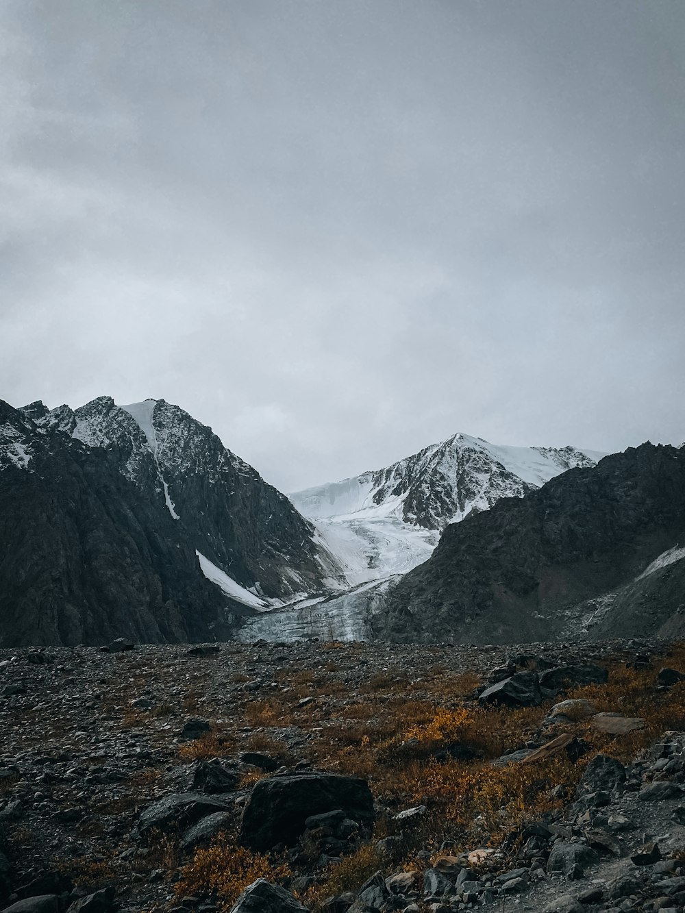 a mountain range with snow on top of it