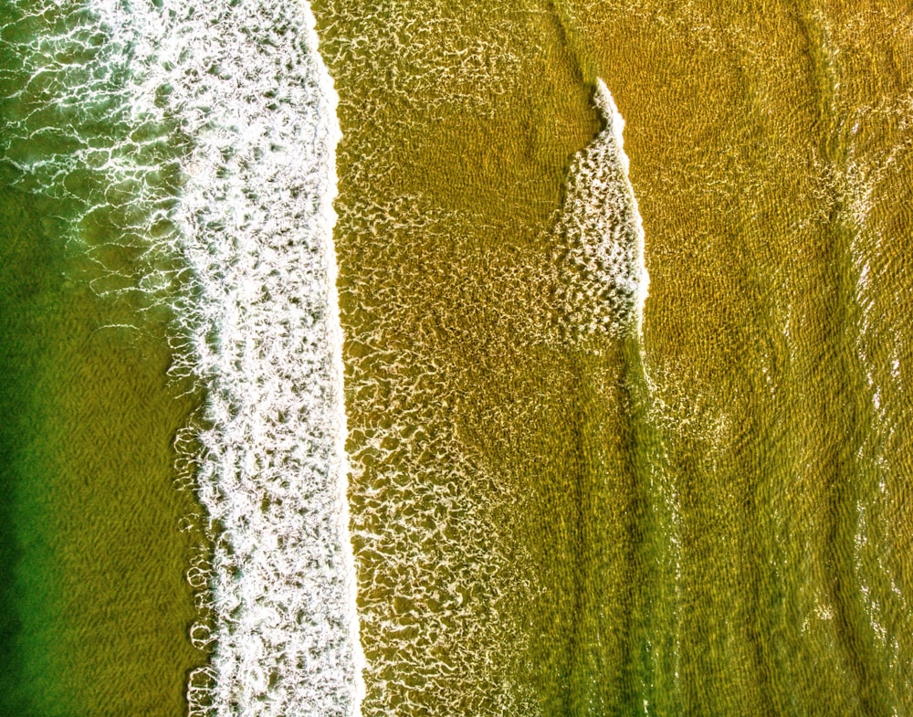 an aerial view of a beach and ocean