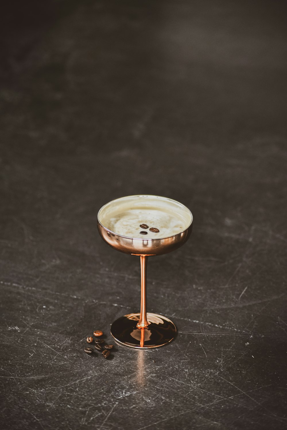 a wine glass sitting on top of a table