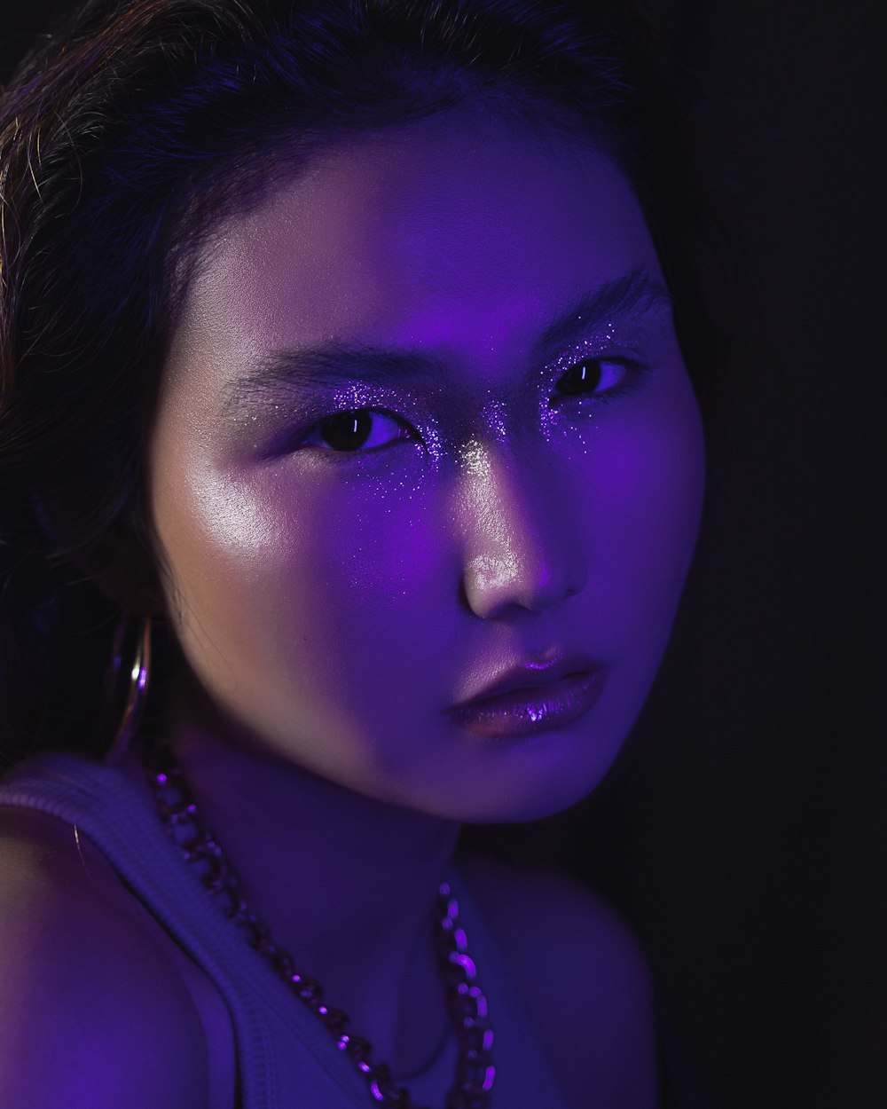a woman with a purple glow on her face