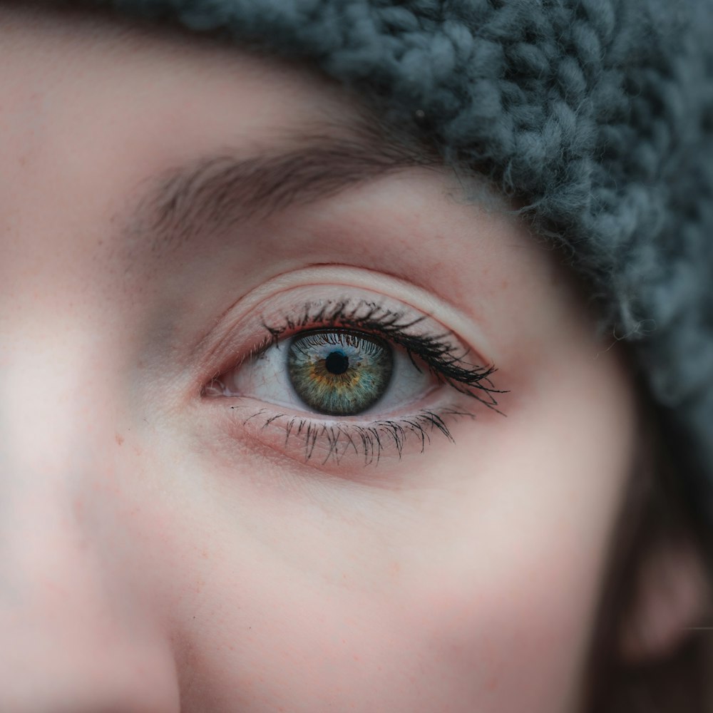 a close up of a woman with her mouth open