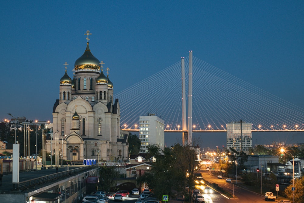 a city street with a bridge in the background