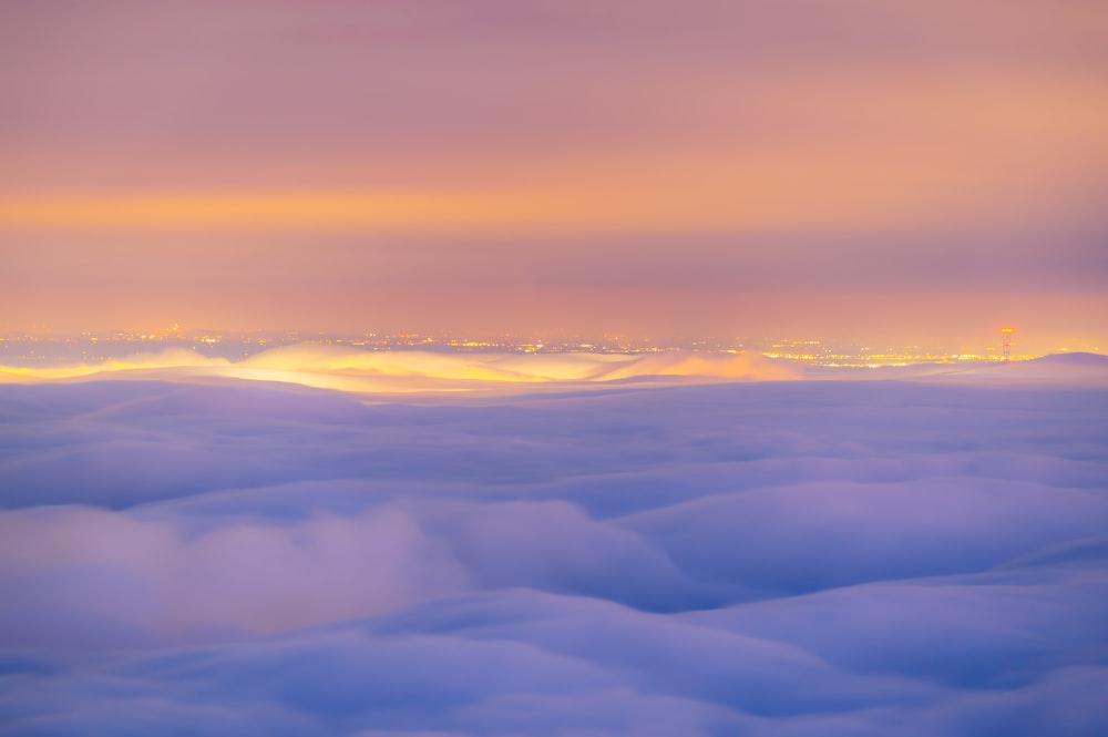 a view of a city from above the clouds