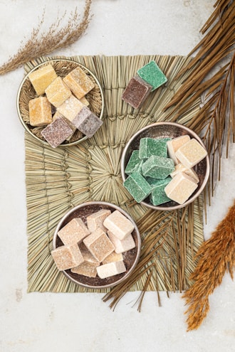 three bowls of marshmallows on a table