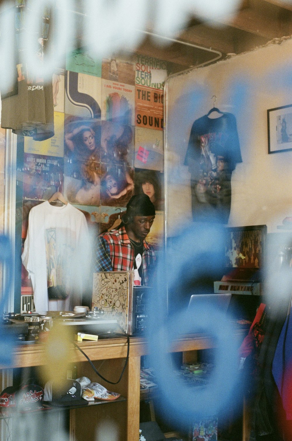 a man standing in front of a store window