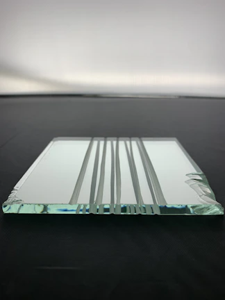 Transparent plexiglass component with smooth edges, ready for assembly.