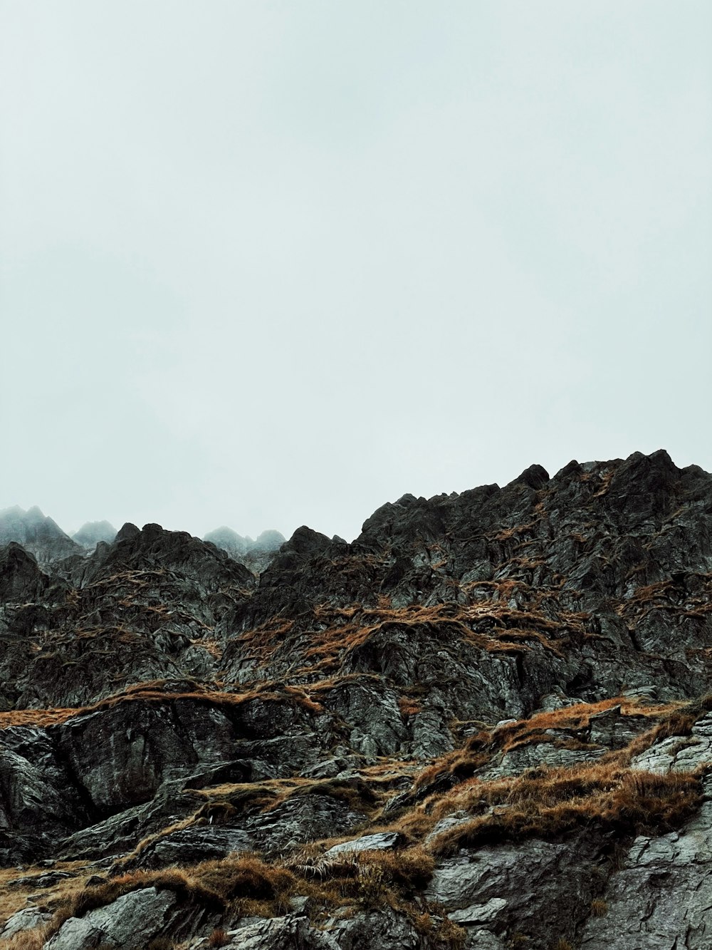 a person standing on top of a rocky mountain