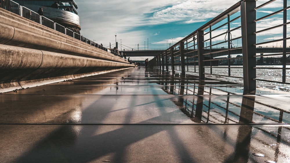 the water is reflecting the sky and clouds