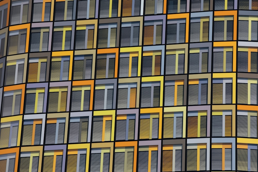 a multicolored building with many windows