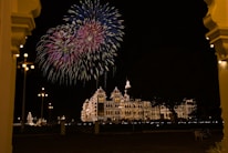 A cinematic 3D rendering of a royal palace entrance glowing under evening lights, setting a majestic wedding tone.