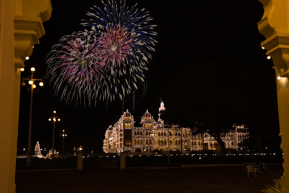a large building with a lot of fireworks in the sky