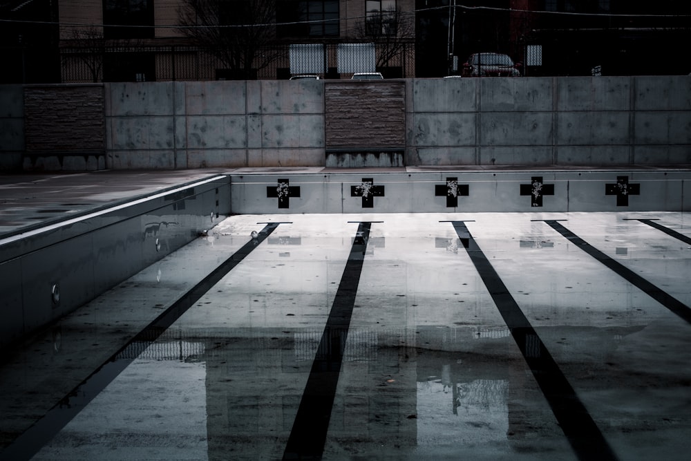 a black and white photo of an empty swimming pool