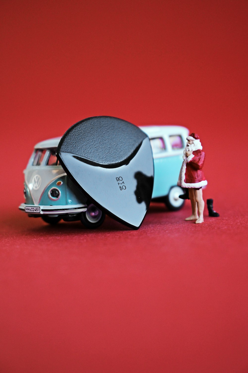 a toy car with a surfboard on top of it