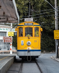 a yellow and blue train traveling down train tracks